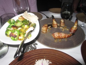 (L to R) Brussels Sprouts with Shiro Miso-Maple Mustard and Bacon Wrapped "Fugu" Blowfish with Black Garlic, Hearts of Palm, Black Pepper, and Lemon