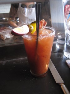 "Olympic Mary," with Monopolowa Vodka, house tomato mix, a salt-pepper rim, Calabrian chili, a pickled egg, and of course, a salami swizzle stick