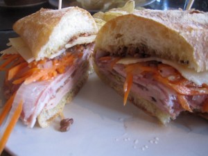 Sandwich with Mortadella, Capicola, Finocchiona, and Provolone, with Pickled Carrots and Olive Tapénade on Ciabatta