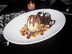 Our Classic Warm Chocolate Soufflé Cake, Honey-Vanilla Ice Cream, Toasted Hazelnuts