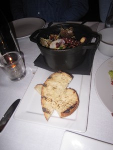 Clams & Octopus with House Cured Nduja, White Beans, Fresh Herbs, and Grilled Bread