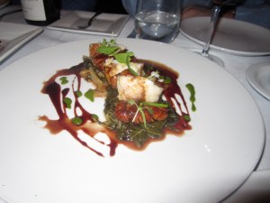Sautéed Sweetbreads and Monkfish with Melted Greens, Verjus- Red Wine Reduction, and Preserved Orange