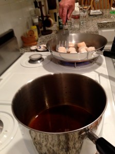 Scallops ready for caramelizing, gastrique boiling