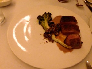 Aged duck breast with broccoli, potato granola, sesame, and raisin cream