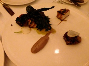 Wood-grilled sturgeon and chicken wings with marinated kale, turnips, and walnut purée